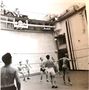 No 77 Squadron Association Kunsan photo gallery - Volley Ball competition in the lift well of HMAS Vengeance.  The lift was used to lower Meteors and equipment into the bowels of the ship.  (photo the late Ian Mackay, information John Bell) 